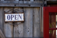 Image: Business door with hanging "OPEN" sign