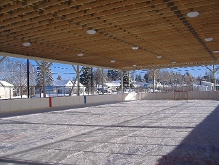 Image: Outdoor winter ice rink under roof covering. 